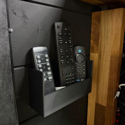 Wall-mounted remote holder for tidy controller storage