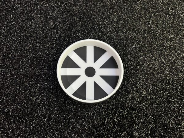 Golf putting cup reducer with 8-spoke design showing white spokes and black triangular sections for precision putting practice