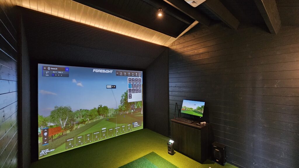 Compact simulator room with warm ceiling lighting