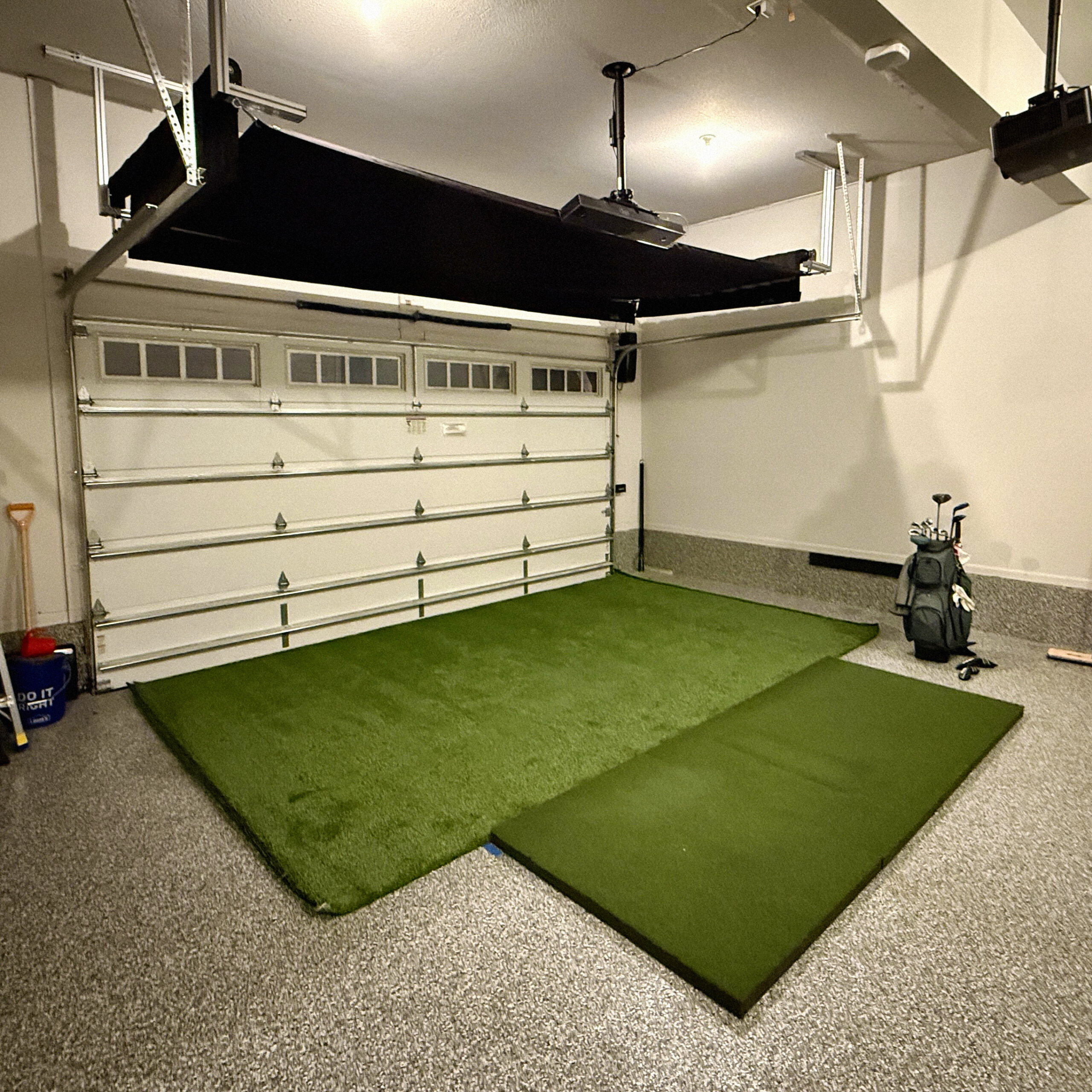 SportScreen Vanish retractable golf simulator screen retracted into garage ceiling