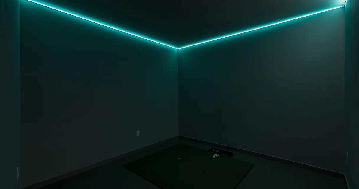RGBW COB LED strip lighting a golf simulator room in teal, one continuous dot-free line of colour